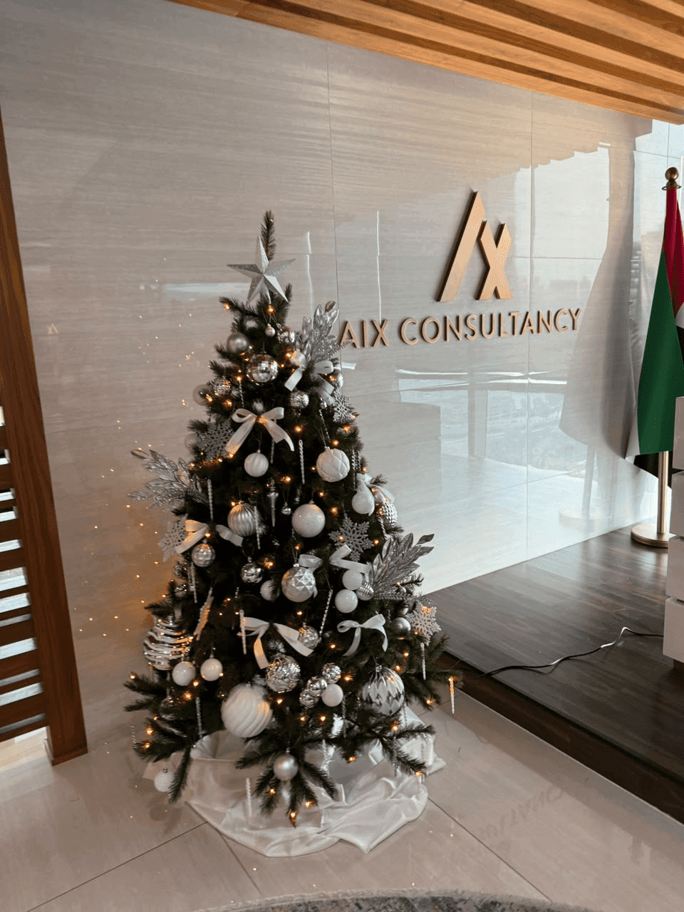 Silver and white Christmas tree in an office reception