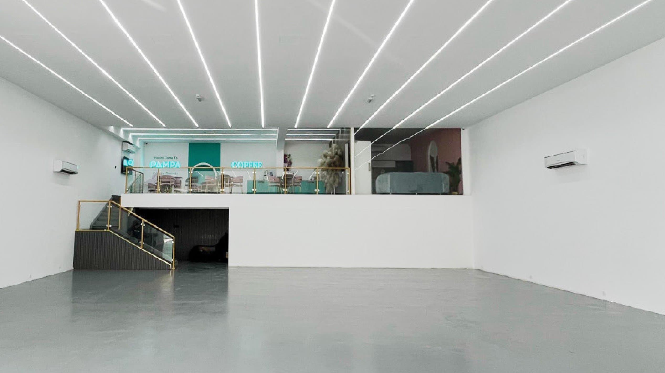 Pampa’s bright white event hall in Al Quoz, with the café lounge on the mezzanine